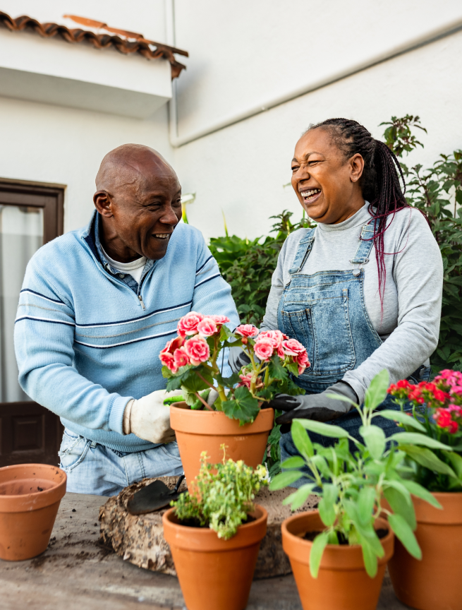 People smiling while gardening
